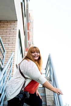 Travel, tourism and entertainment. Plus size woman photographer working at the street