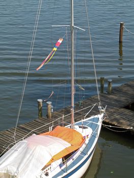Sailing boat on the Müritz, which has moored at the pier, Mecklenburg-Western Pomerania, Germany.