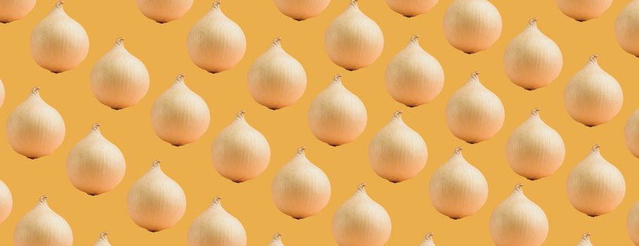 Seamless pattern of white onions on an orange background. The texture of the food.