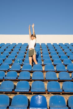 Healthy lifestyle concept. Teenage doing sports alone at the empty stadium