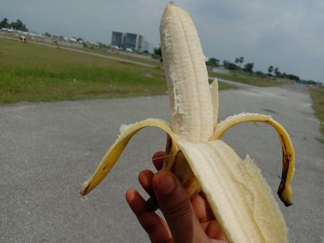 tasty and healthy expanded banana closeup on hand
