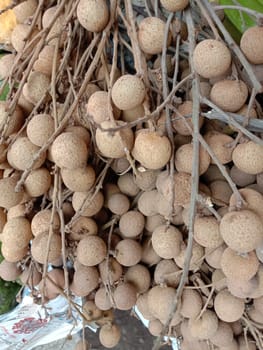 Tasty and Healthy Longan Stock on Wooden Table