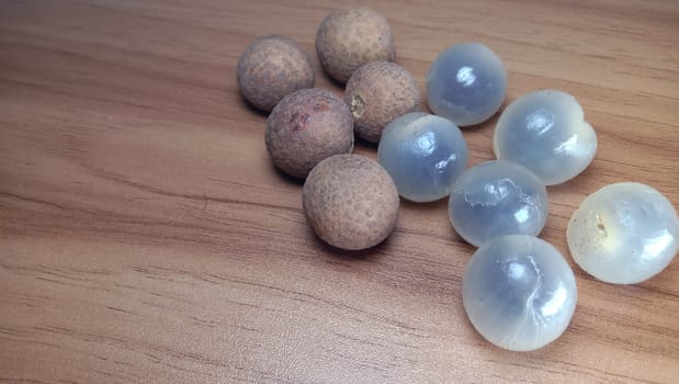 Tasty and Healthy Longan Stock on Wooden Table