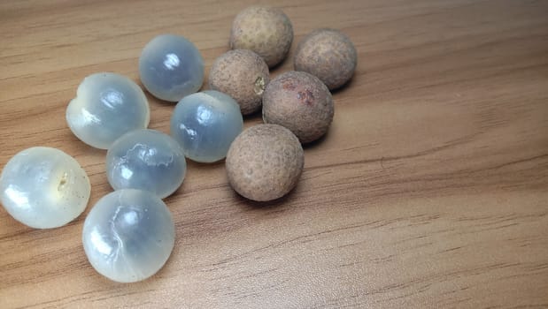 Tasty and Healthy Longan Stock on Wooden Table