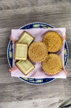 food combination with biscuits on a wooden table from above