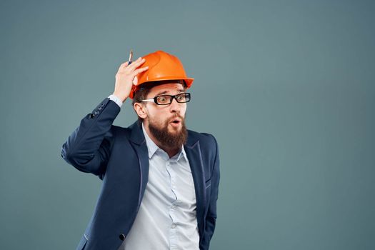 Man in orange paint construction engineer lifestyle cropped view. High quality photo