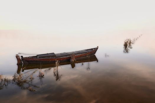 Small fishing boat on the lake, no horizon, high key