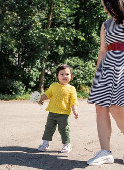 Multiethnic family. Happy multiracial family of mother and daughter walking in the park