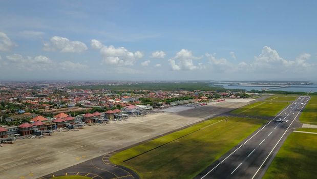The aircraft has just landed at Bali International Airport, Denpasar, Indonesia. The plane from Jakarta prepare taxing to the gate at Ngurah Rai Airport.