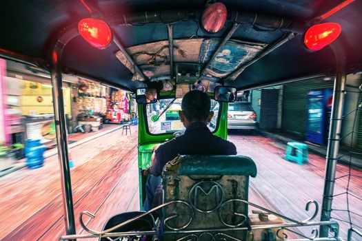 BANGKOK - JANUARY: Tuk - tuk on Chinatown street at daylight on Jan 09, 2016 in Bangkok Thailand