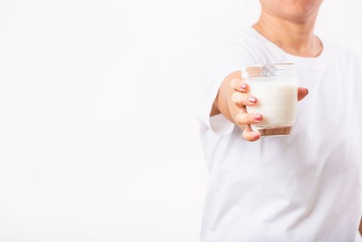 Asian portrait of happy young Asian beauty woman use hands hold drink white milk from a glass, studio shot isolated on white background, Food healthy care concept