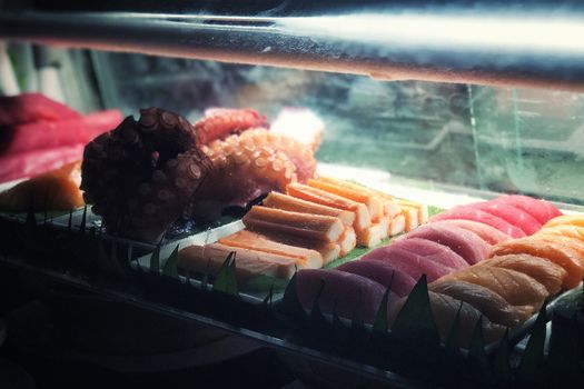 Japanese food sashimi bar salmon ,octoput ,shimp and tuna concept low light 
