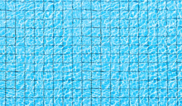 Top view of swimming pool bottom caustics ripple and flow with waves background. Summer background. Texture of water surface. 