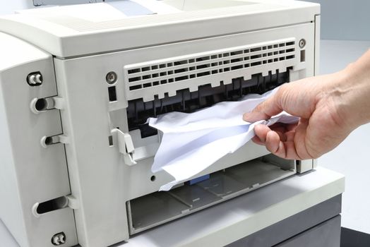 Technicians Removing Paper Stuck, Paper Jam In Printer At Office