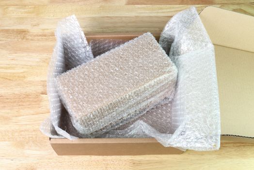 Bubbles covering the box by bubble wrap for protection product cracked  or insurance During transit 