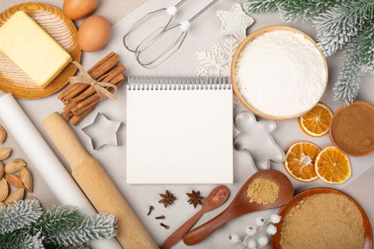 Christmas gingerbread cookies cooking background flat lay top view template with copy space for text. Baking utensils, spices and food ingredients