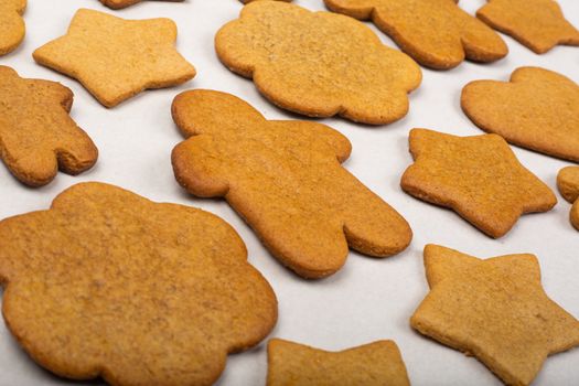 Gingerbread men stars and snowflakes not glazed cookies Christmas background