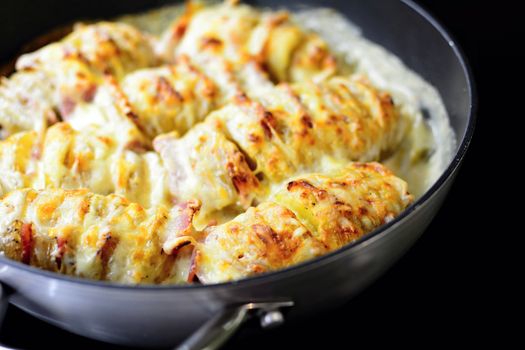 Baked Crispy Croque Monsieur Hasselback Potatoes Stuffed With Bacon, Cheese, Covered With Bechamel Sauce In Pan.