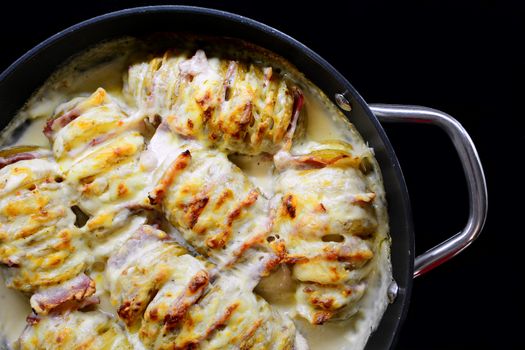 Baked Crispy Croque Monsieur Hasselback Potatoes Stuffed With Bacon, Cheese, Covered With Bechamel Sauce In Pan.