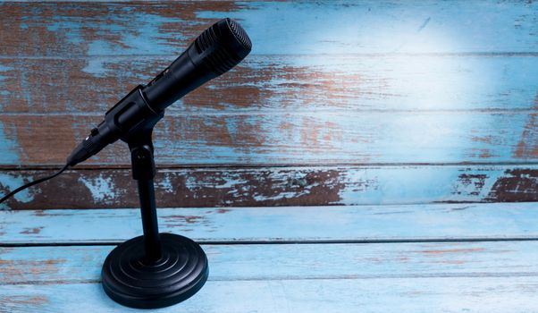 Microphone with stand on vintage background