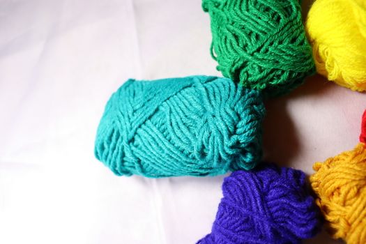 multiple colored yarn stock on white background