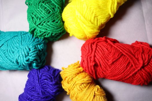 multiple colored yarn stock on white background