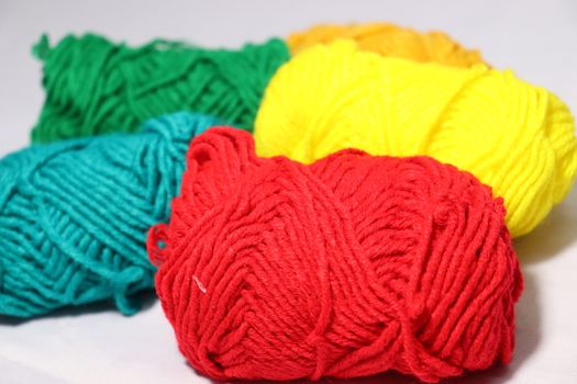 multiple colored yarn stock on white background