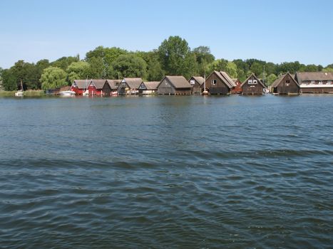 Lake Mueritz with thatched boathouses in Mecklenburg-Western Pomerania, Germany.