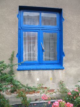 Blue painted window frame seen in Mecklenburg-Western Pomerania, Germany.