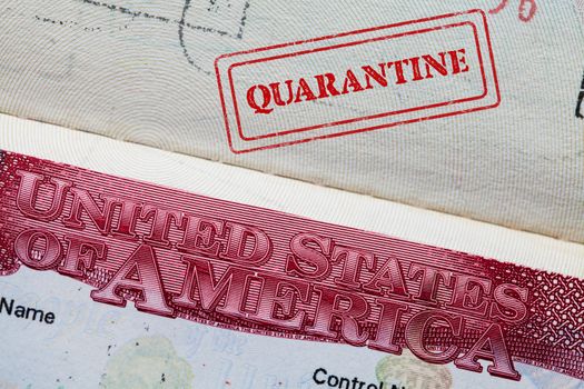 Passport with U.S. visa with QUARANTINE stamped upon arrival / departure, medical health check positive for COVID-19 corona virus disease,global pandemic outbreak of Coronavirus infection,world crisis