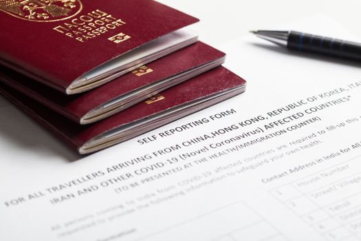 Passports and self reporting form for all travellers arriving from 2019-nCoV affected countries, COVID-19 corona virus disease global pandemic, airport customs border security control and health check
