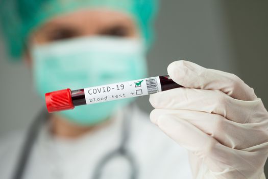 Doctor holding test tube with Coronavirus patient blood sample,NEGATIVE Covid-19 test results,global pandemic crisis, deadly corona virus disease hematology WHO testing procedure illustration concept