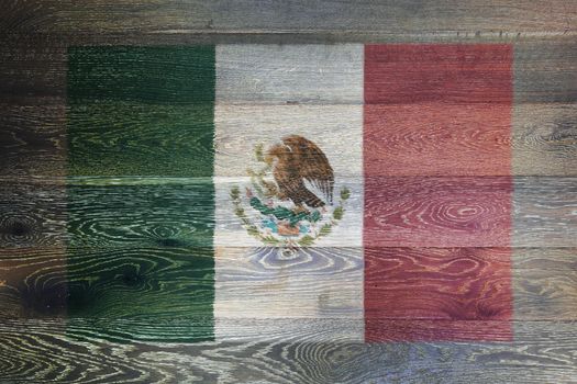 A Mexico flag on rustic old wood surface background
