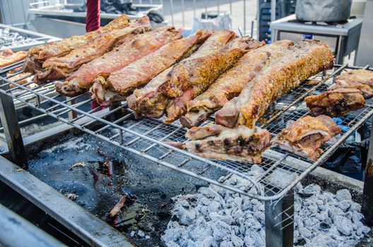 Peruvian food: roasted pork with charcoal or stick