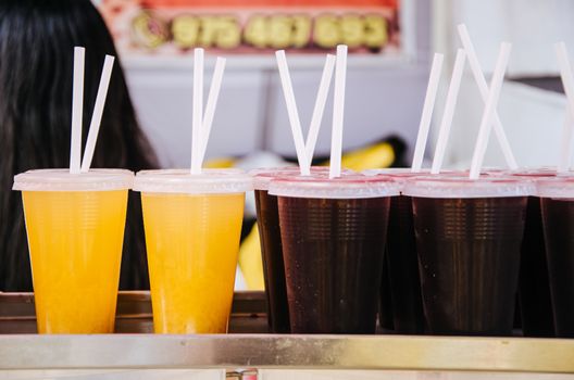 purple corn juice called chicha morada in Peru and next to it pineapple juice