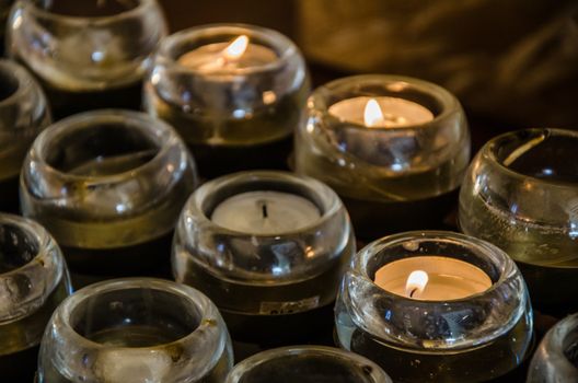 Image of Easter candles burning at night with golden light of candle flame