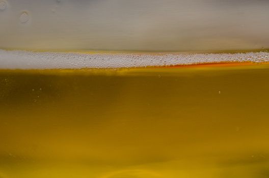 beer in close-up shot, beer background with foam