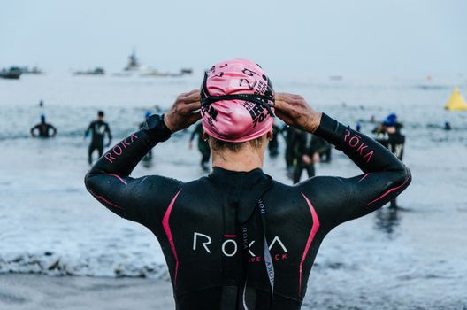 LIMA, PERU - APRIL 22th 2018: Ironman 70.3 . Athlete preparing for the competition and enter to swim