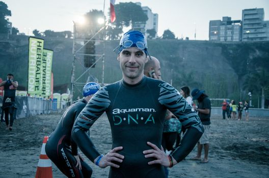 LIMA, PERU - APRIL 22th 2018: Ironman 70.3 . Athlete preparing for the competition and enter to swim
