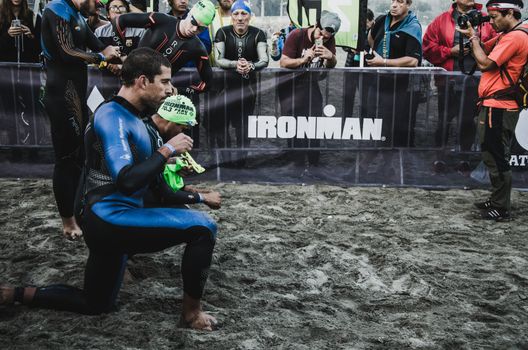 LIMA, PERU - APRIL 22th 2018: Ironman 70.3 . Athlete preparing for the competition and enter to swim