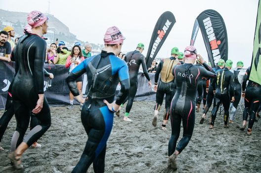 LIMA, PERU - APRIL 22th 2018: Ironman 70.3 . Athlete preparing for the competition and enter to swim