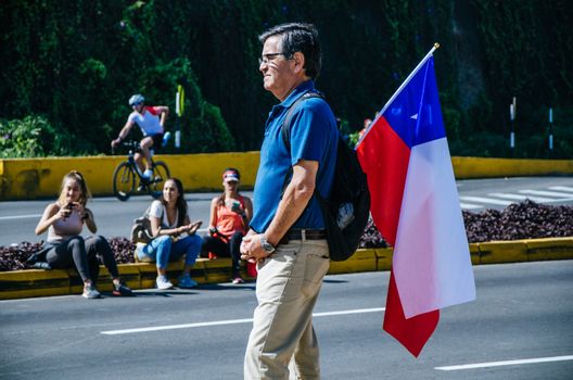 LIMA, PERU - APRIL 22th 2018: Ironman 70.3 . Public spectator supporting his country or relatives in the race