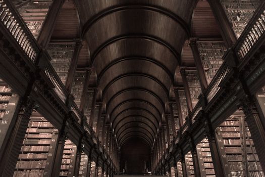 The Long Room in the Trinity College Library on Feb 15, 2014 in Dublin, Ireland. Trinity College Library is the largest library in Ireland and home to The Book of Kells.