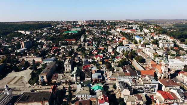 View from above of the old town and new houses with colorful bright roofs. Air view