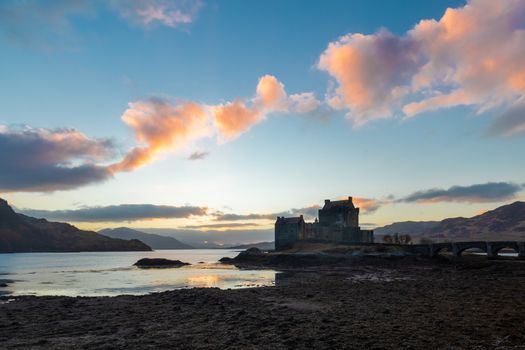 Elean donan castle sunset colorful sky orange blue