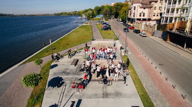 Young people dancing, singing and playing sports on the city s waterfront. Ternopil, Ukraine. View from above, aerial shooting from drone