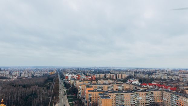 Aerial view of city, road and moving cars and park from a bird's eye view. Ukraine Ternopil