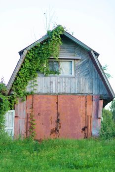 Destroyed abandoned house standing in the russian village.