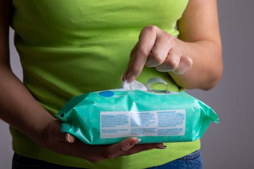 Taking wet wipes from the packaging - hygiene procedure and prevention of infectious diseases