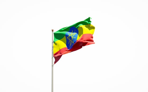 Beautiful national state flag of Ethiopia on white background. Isolated close-up Ethiopia flag 3D artwork.